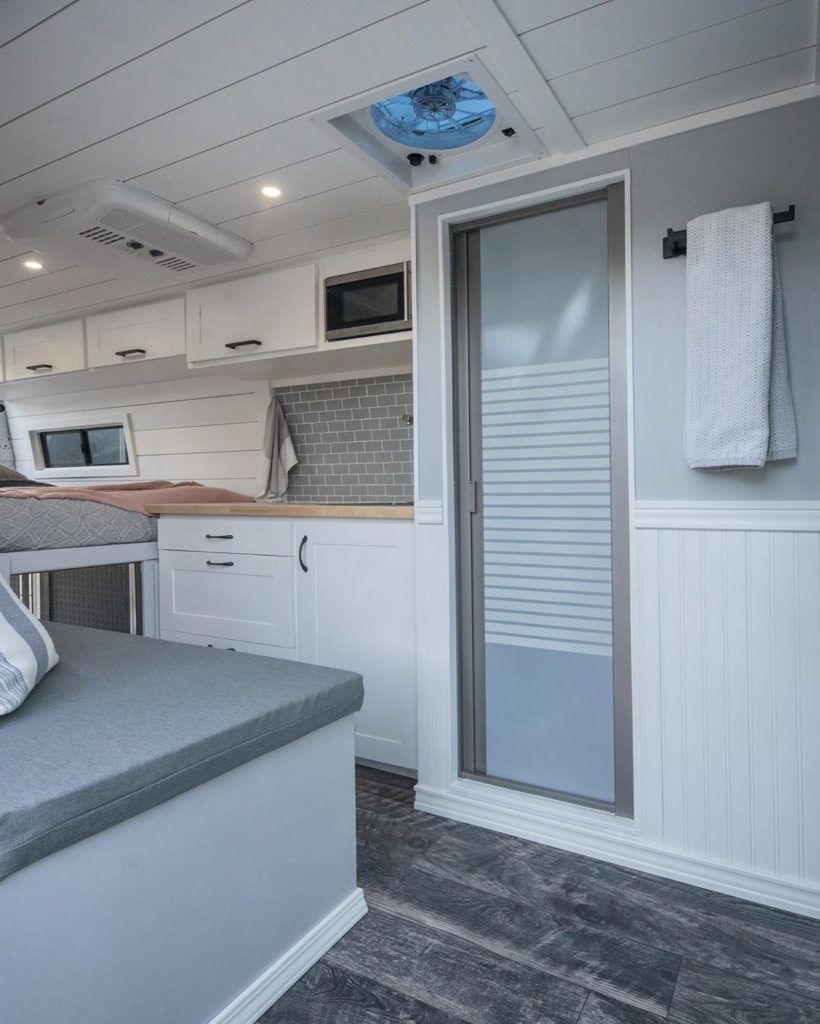 Camper van bathroom setup with indoor shower by @the_activ