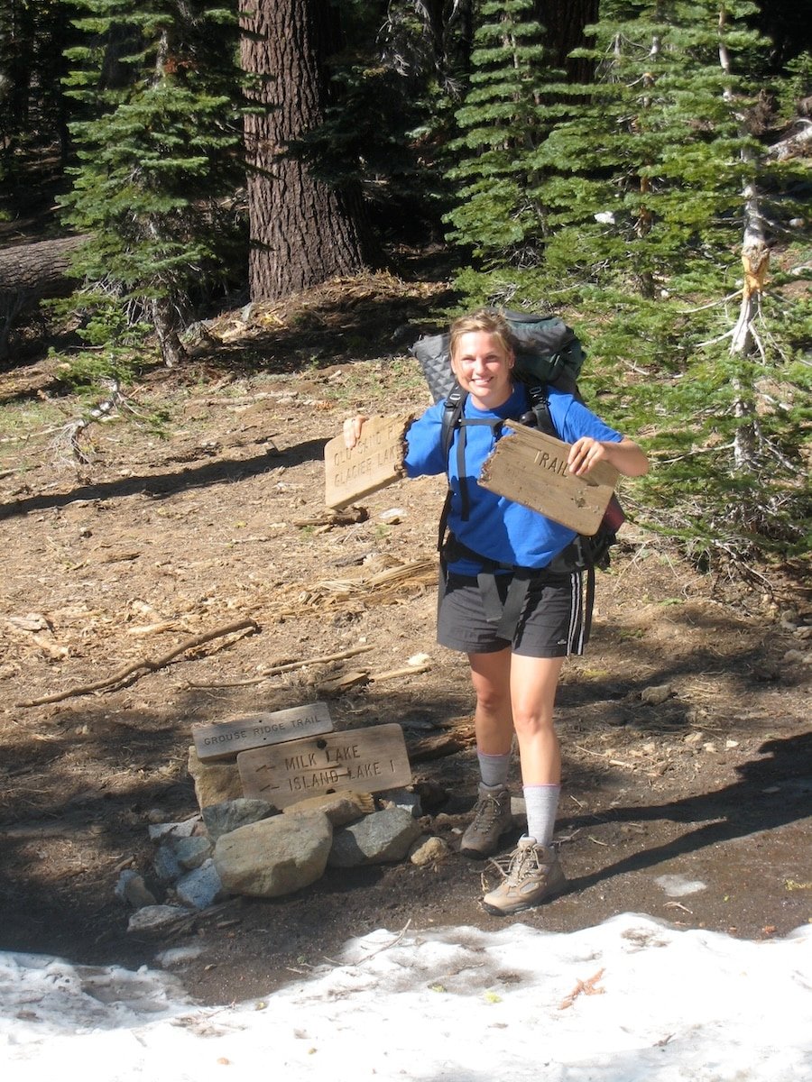 Kristen Bor holding a broken trail sign