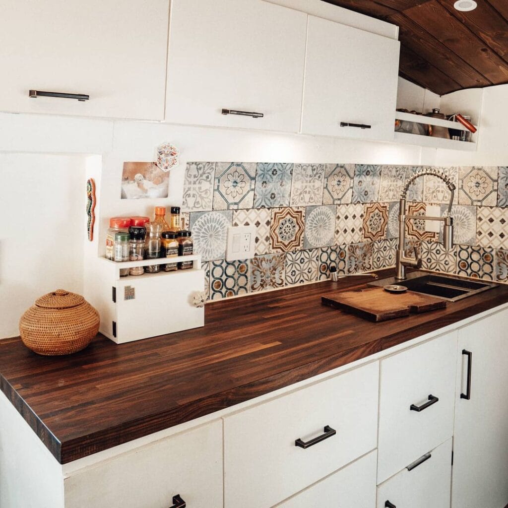 Van kitchen by @asobolife / Check out these camper van galleys for ideas on layout, appliances, storage, and more