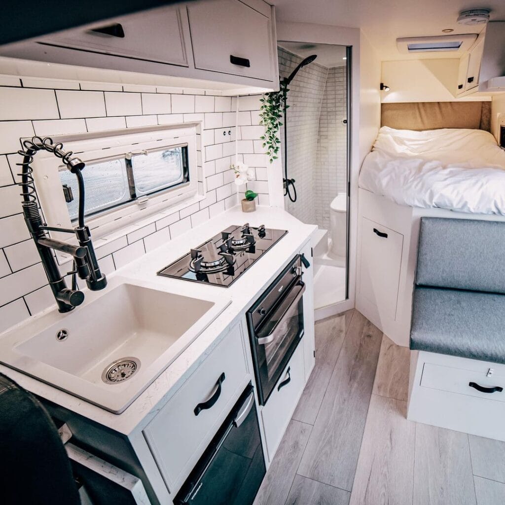 Van kitchen by Escape Conversions / Check out these van galleys for ideas on layout, appliances, storage, and more