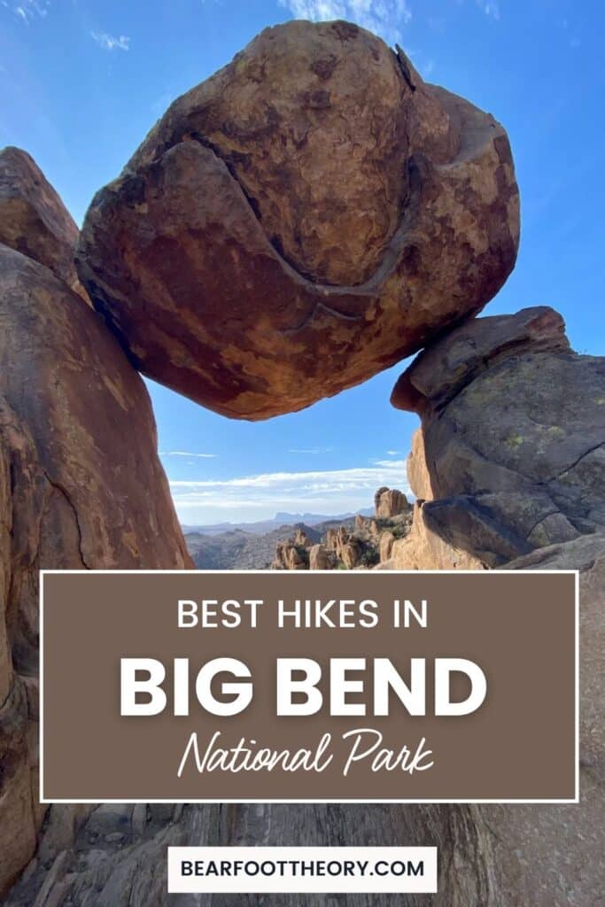 A large boulder balanced between two rock formations under a clear blue sky. Text on the image reads, "Best Hikes in Big Bend National Park," with "bearfoottheory.com" at the bottom. Rugged landscape and distant mountains are visible in the background.