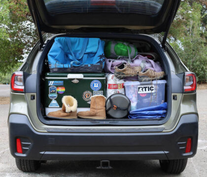 Trunk of Subaru packed with car camping essentials
