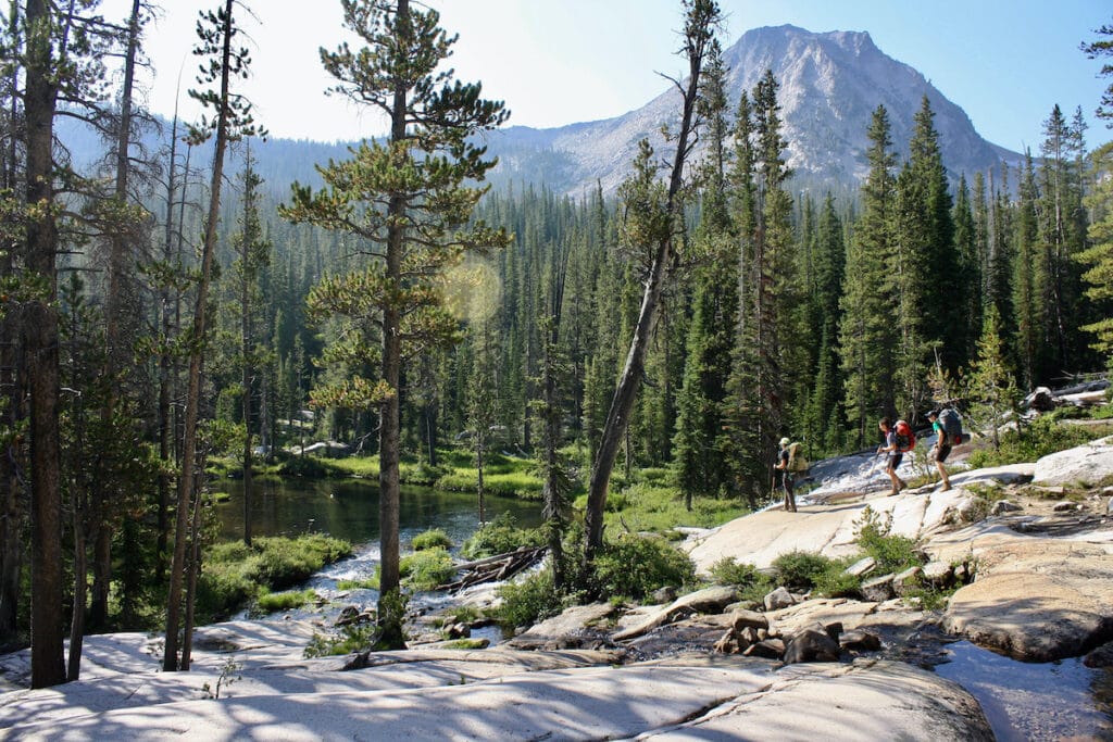 Friends hiking // Get tips on how to be a good LGBTQ+ ally outdoors and on the trail so everyone can feel included and welcome outside