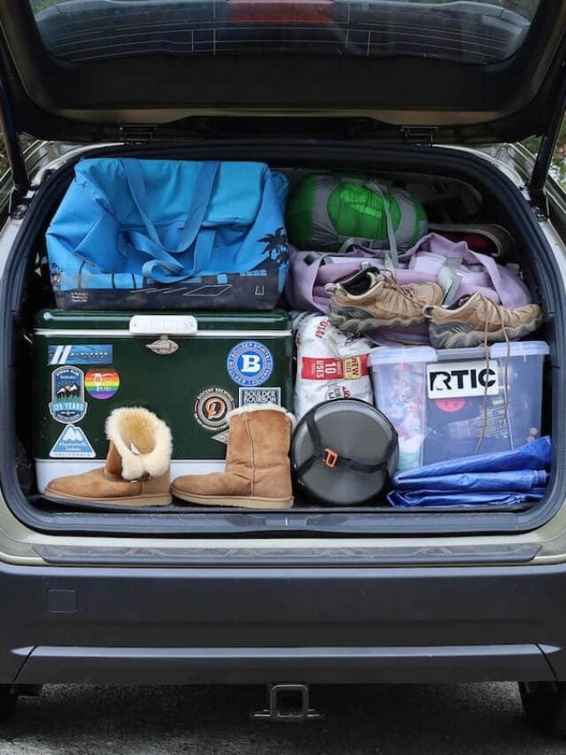 Trunk of Subaru packed with car camping essentials