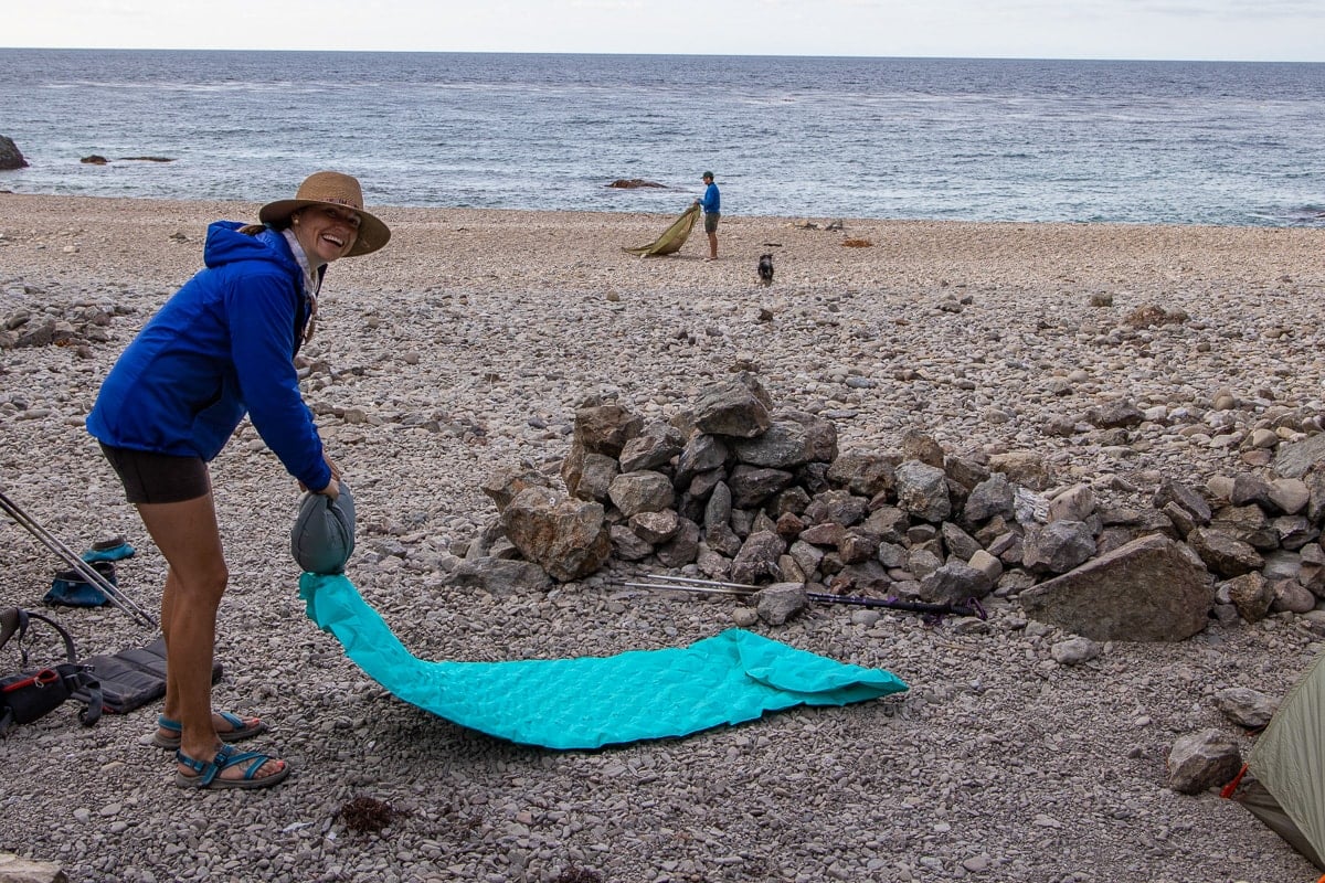 Kristen Bor using the stuff sack to blow up my Sea to Summit Comfort Light Insulated Sleeping Pad on the Trans-Catalina Trail