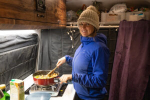 This van life cooking guide shares tips for making easy meals in a camper van including how to plan, save money, and make doing dishes easy.
