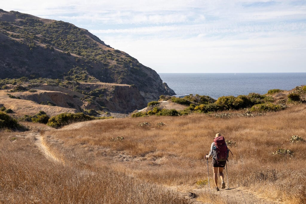 Backpacking on Trans-Catalina Trail with ocean views in distance