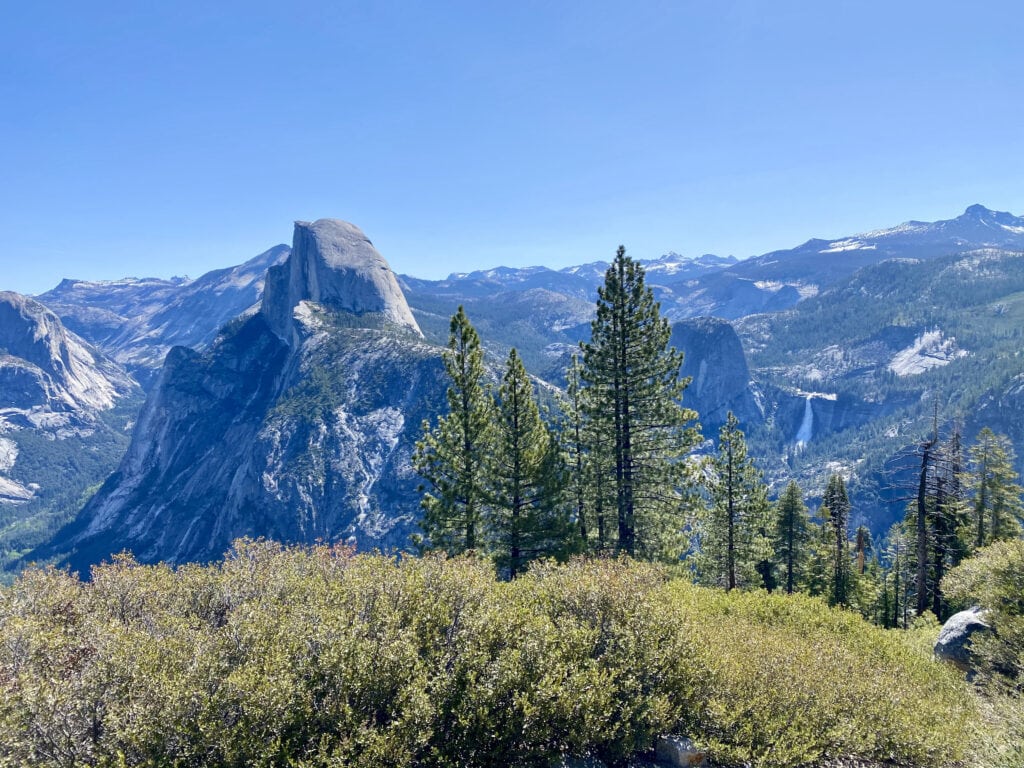 Overlooking Half Dome and Nevada Falls, Yosemite National Park // Looking for the best things to do in Yosemite National Park? Our guide covers Yosemite camping, hiking, & everything else you need to know.