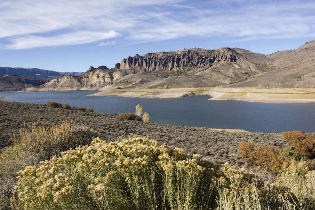 Blue Mesa Reservoir // Discover the best places to SUP in Colorado this summer with the best Rocky Mountain views, calm waters, and quiet solitude. 