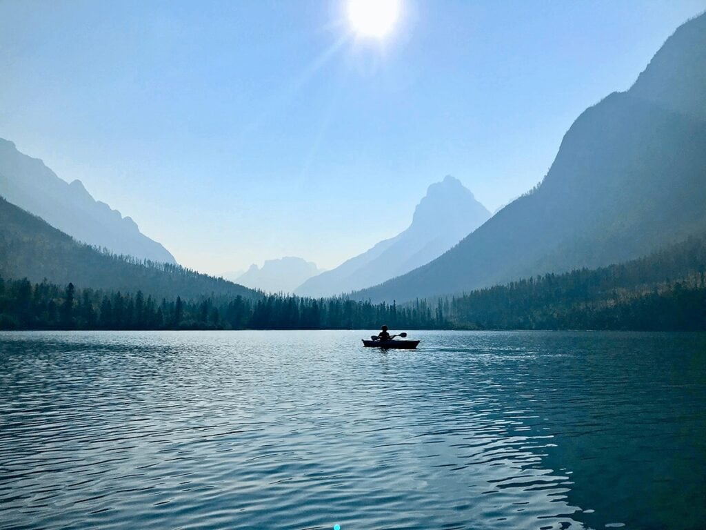 Flathead Lake / Learn the best kayak camping tips for beginners including essential kayak camping gear, how to pack a kayak, tips for buying a kayak, & more.