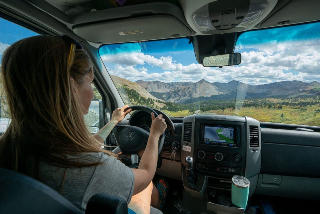 Kristen driving her Sprinter van // Learn about Progressive RV insurance including what vehicles are covered, different coverage options, & tips for insuring your camper van.