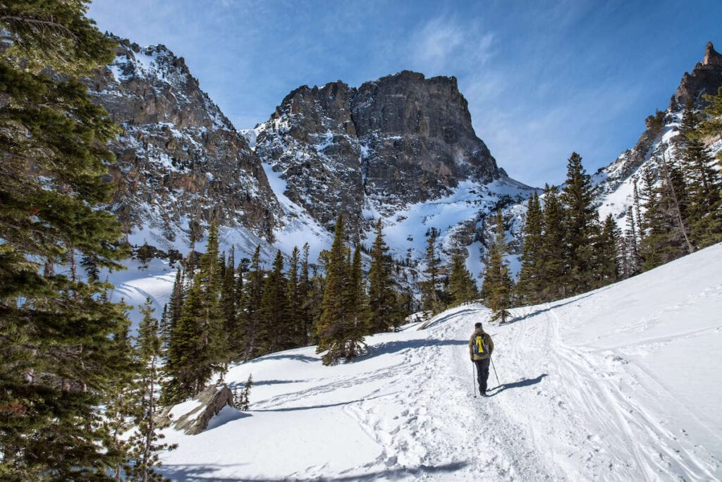 Winter hike to Emerald Lake // Explore Rocky Mountain National Park in winter with our complete winter guide including where to stay, outdoor activities, & what to pack.