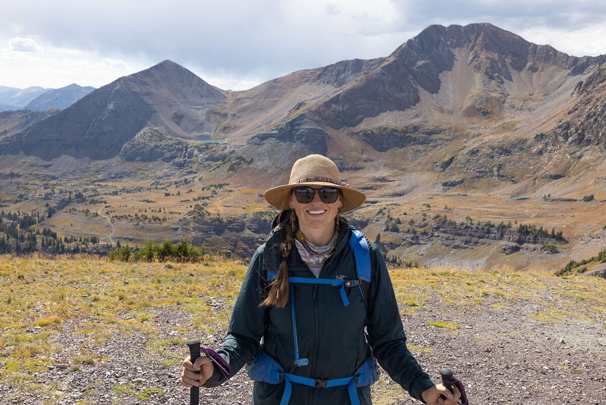 Female hiker wearing hiking gear in high desert area of Colorado