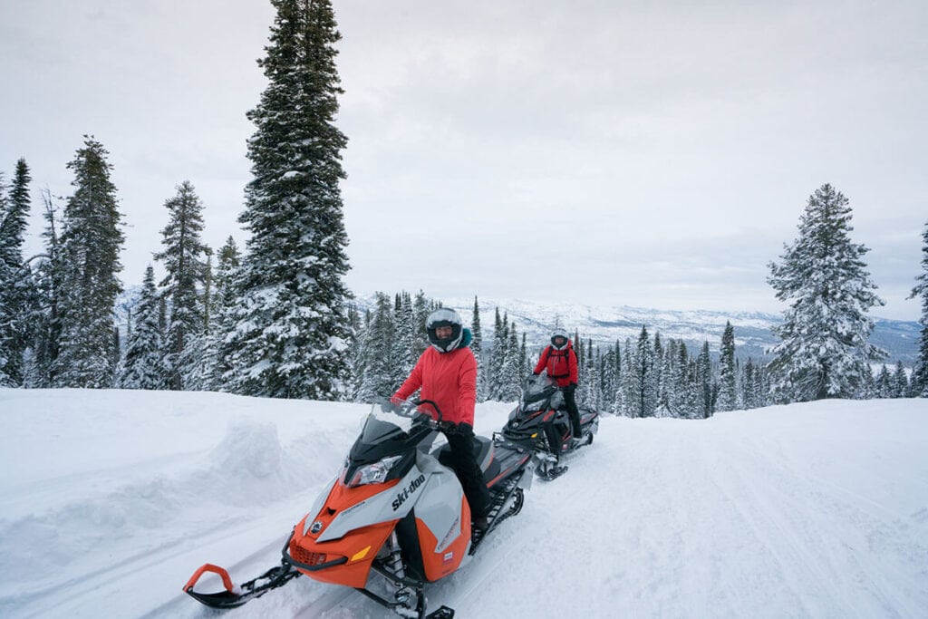 Snowmobiling to Burgdorf Hot Springs // Start planning your Idaho winter vacation with these fun winter activities, from hot springs to snowmobiling to dog sledding and more.