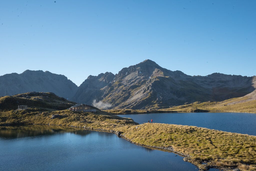 Learn how to backpack (or tramp) to one of New Zealand's amazing backcountry huts.