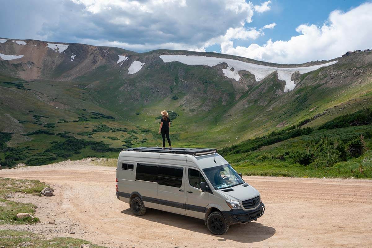 Campervan parked at scenic overlook on Fall River Road in Rocky Mountain National Park, Colorado
