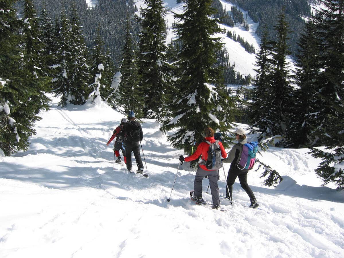 Group snowshoeing to Kendall Peak // Explore the best Washington snowshoeing routes this winter with our detailed trail guides and important winter safety information.