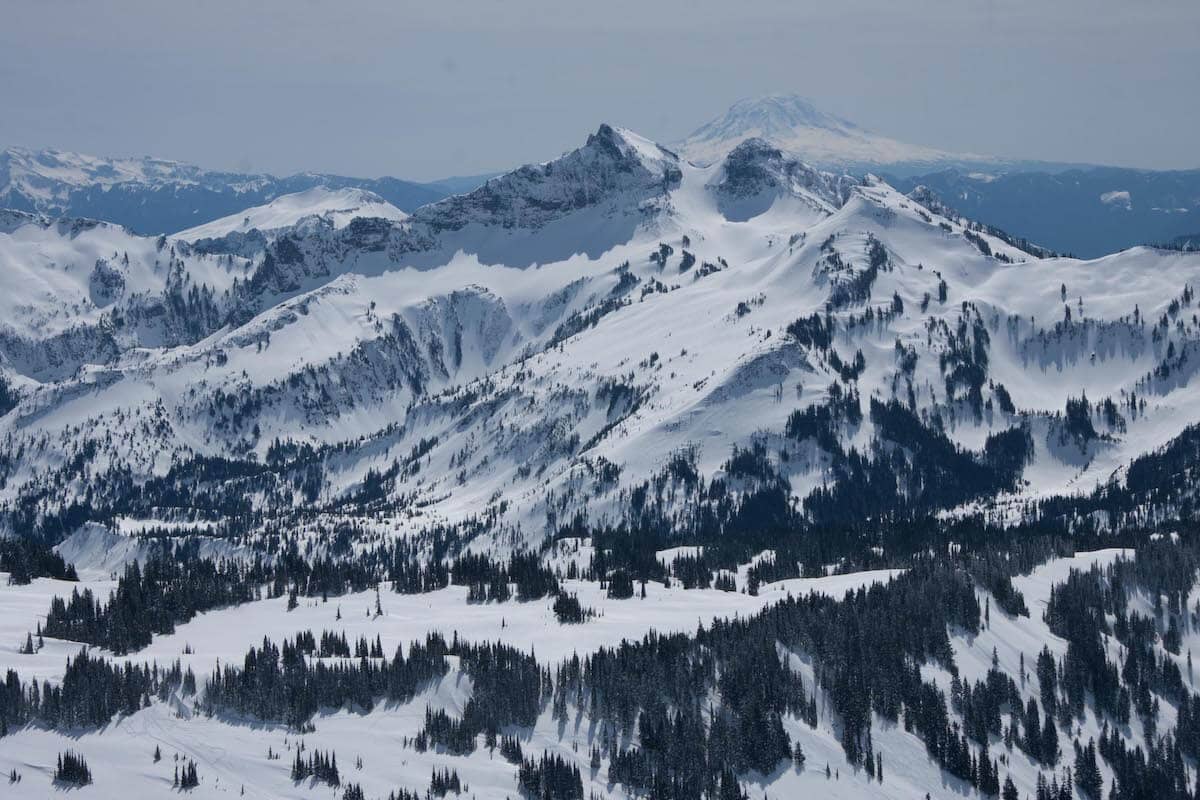 Snow covered peaks at Panorama Point // Explore the best Washington snowshoeing routes this winter with our detailed trail guides and important winter safety information.