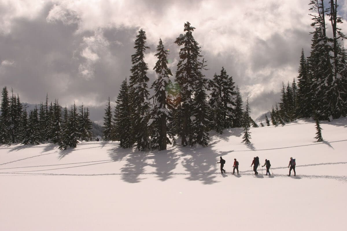 Group snowshoeing to Skyline Lake // Explore the best Washington snowshoeing routes this winter with our detailed trail guides and important winter safety information.