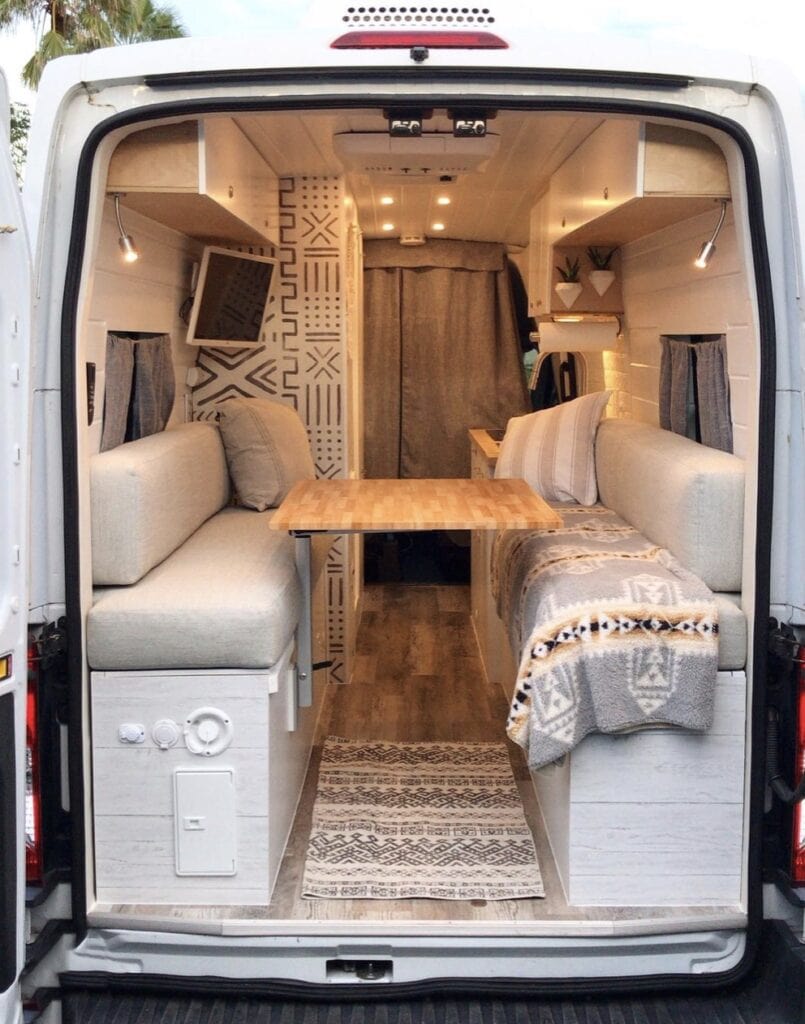 Camper van layout from the back with a convertible bed