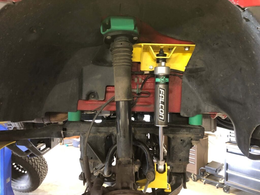 Second front shock added underneath Sprinter van for upgraded Sprinter suspension system