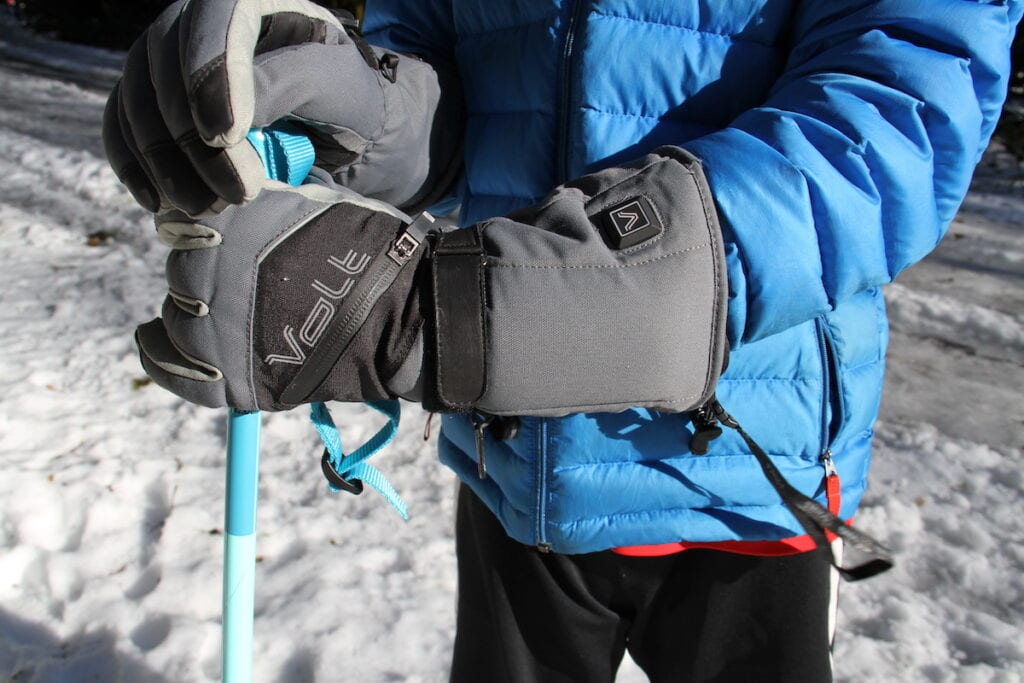 Volt Impulse X // close up of a person clutching a ski pole wearing women's heated gloves