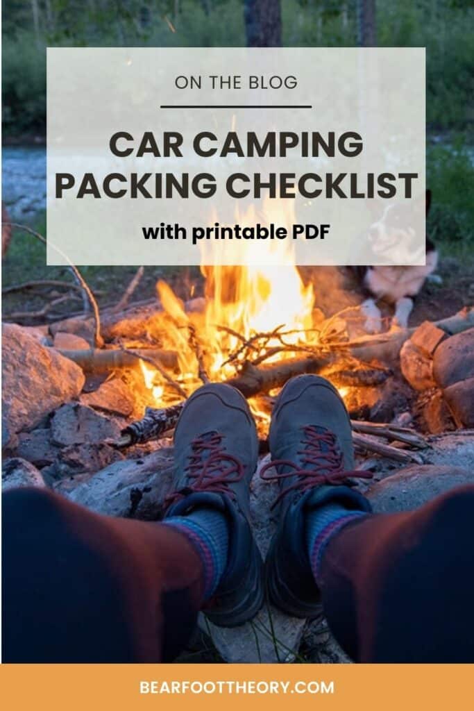 A woman's feet in hiking boots in front of a campfire with text that says "Car Camping Packing Checklist with printable PDF"