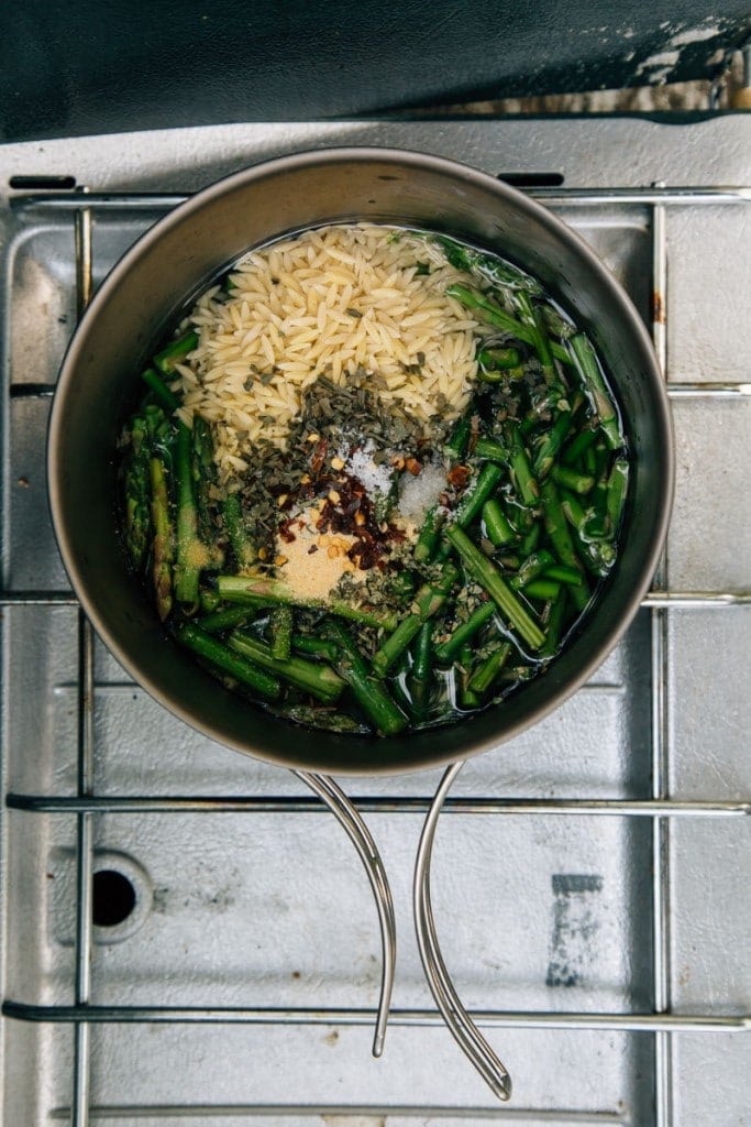 Cheesy Asparagus Orzo one pot camping meal cooking on a camp stove