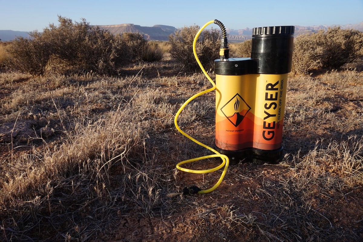 The Geyser Systems Portable Shower sitting on a grassy ground