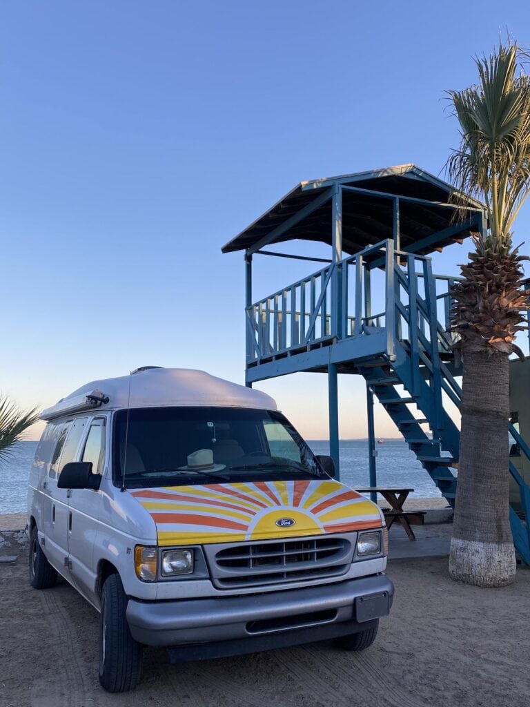 A white campervan doing Baja van life in San Felipe