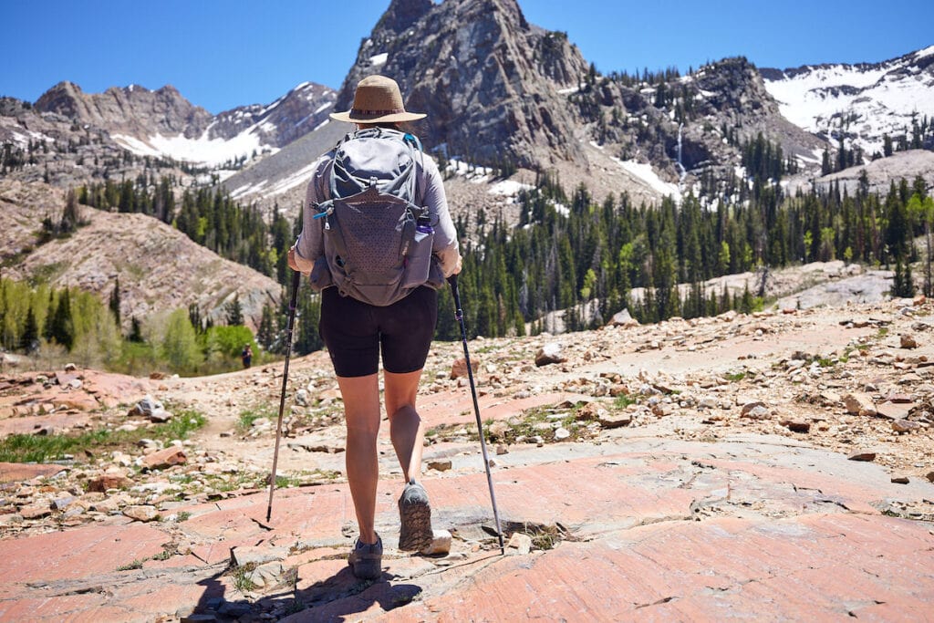 A woman hiking Lake Blanche in Salt Lake City wearing Oboz Sawtooth X low hiking boots