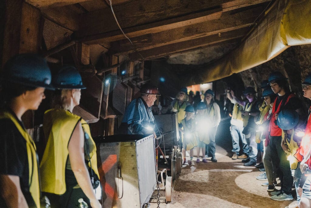 Group of tourists underground on the Queen Mine Tour in Bisbee, Arizona