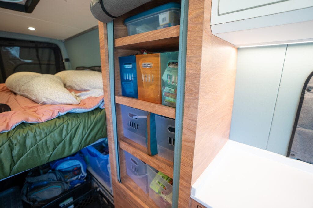 Closet in in a 170" sprinter van conversion built by Outside Van