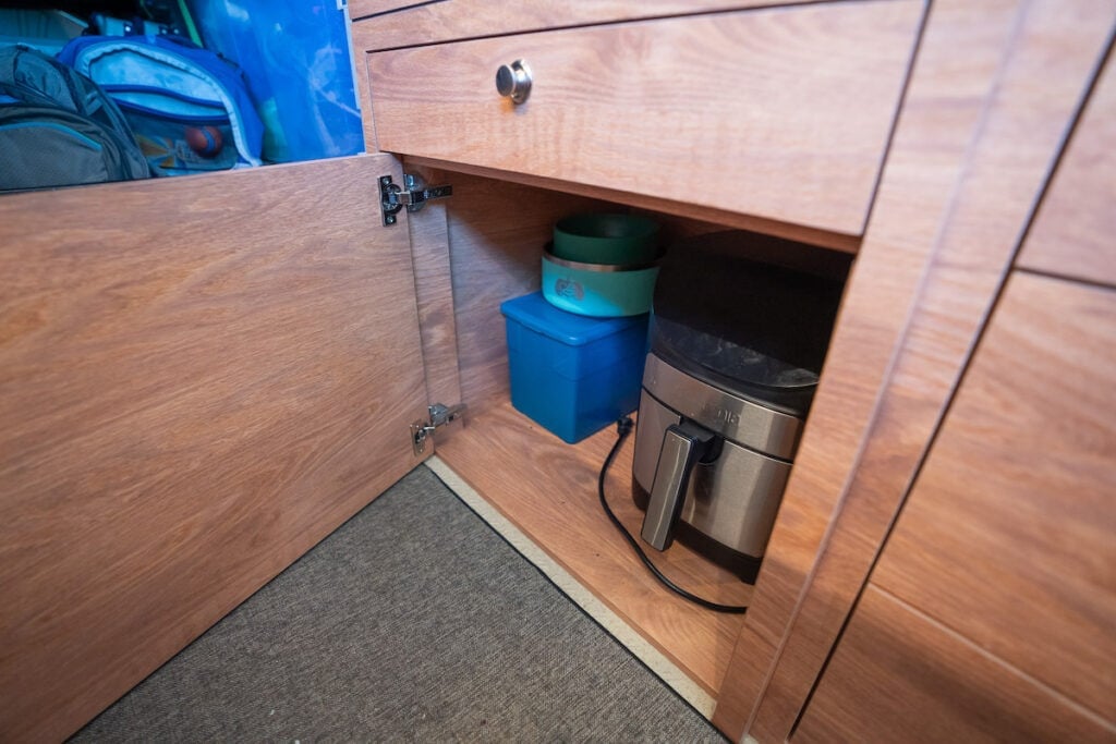 Storage in a Sprinter Van conversion built by Outside Van