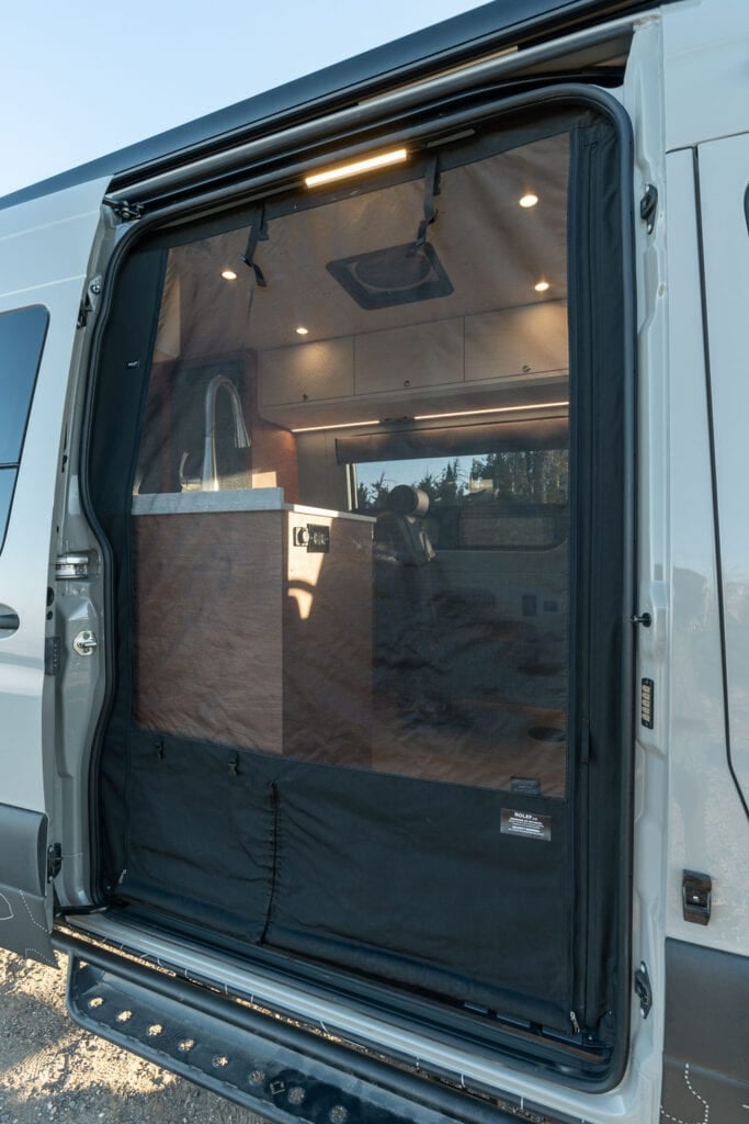 Rolef bug screen on the slider door of a 170" Sprinter Van conversion