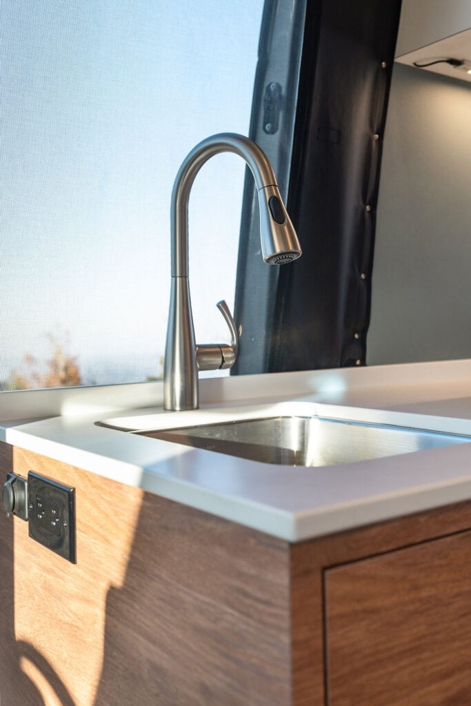 Sink and Faucet in the galley of a 170" Sprinter Van conversion