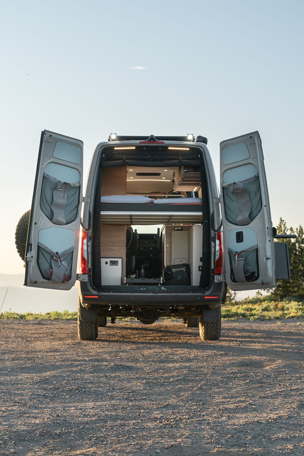 Garage area underneath the bed in a 4x4 Sprinter Van Conversion built by Outside Van