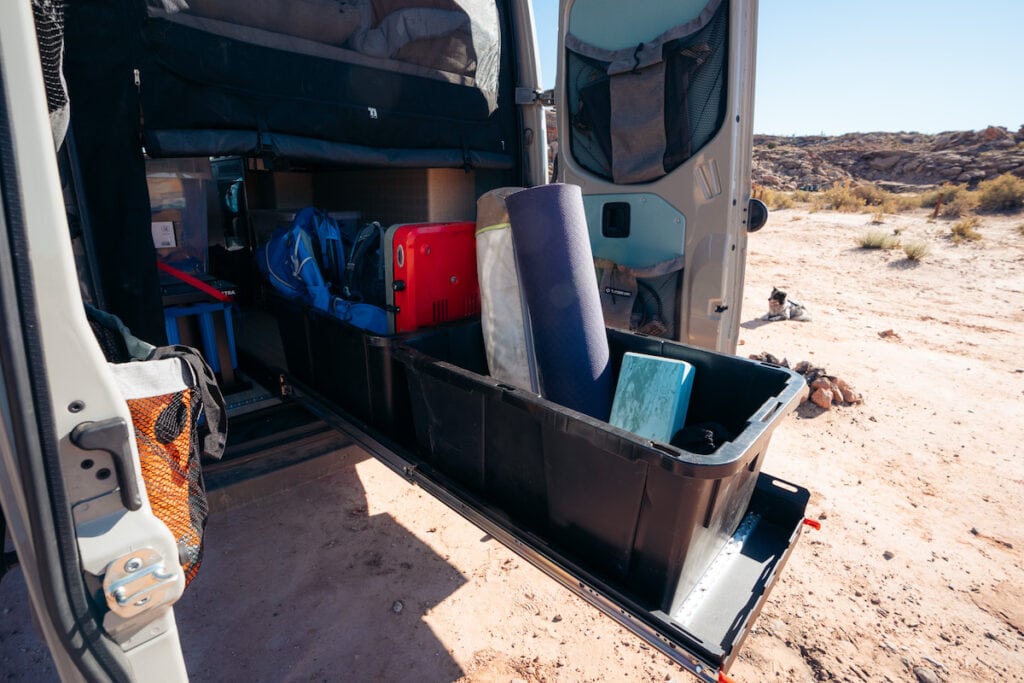 Tray slide-out packed with gear at back of converter Sprinter van