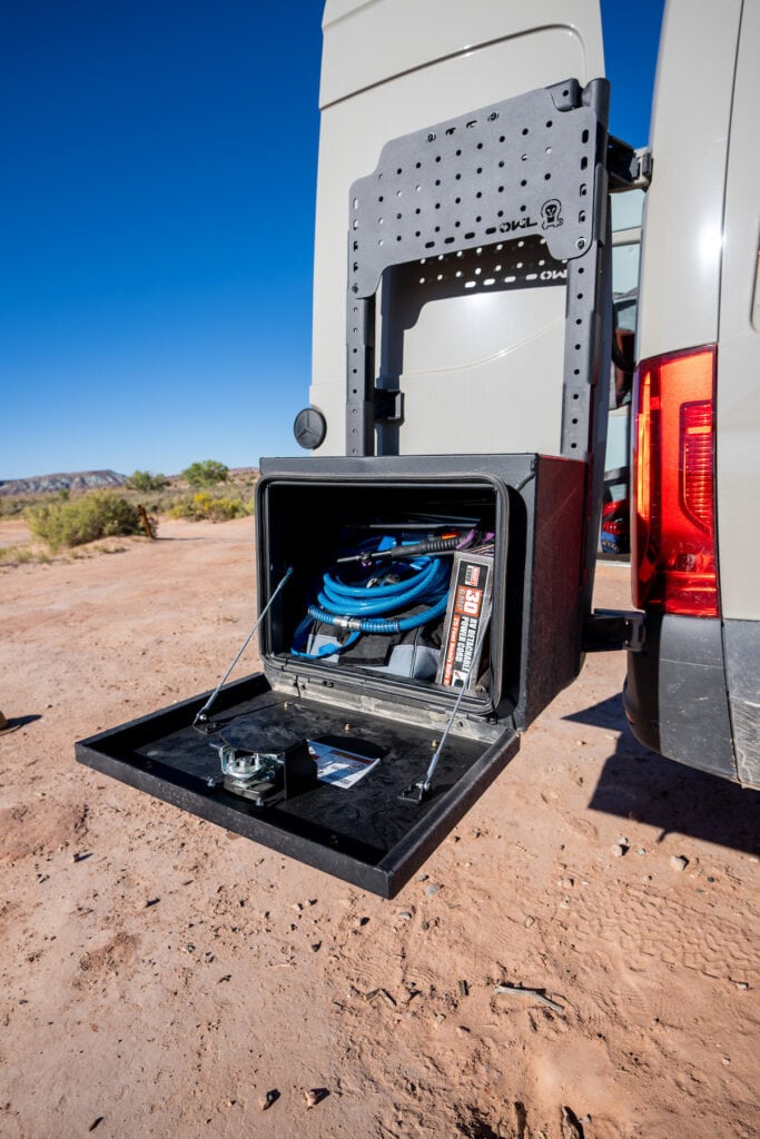 Owl Engineering B2, Medium Expedition Box, and Mini Sherpa plate on the back of a 4x4 Sprinter Van designed for outdoor adventure