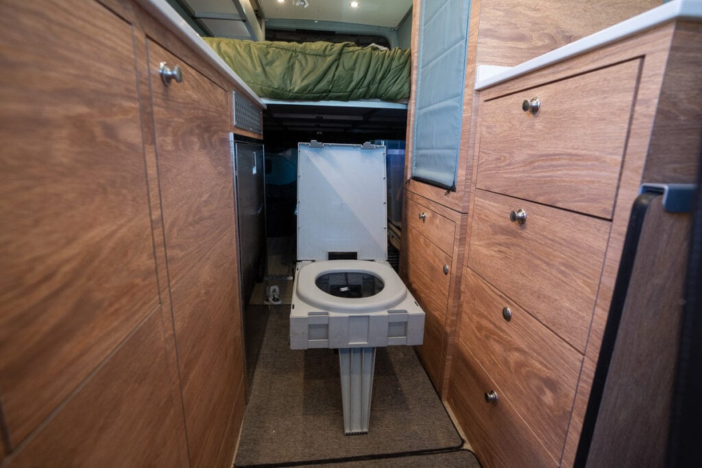 Portable GoAnywhere toilet in a Sprinter Van conversion