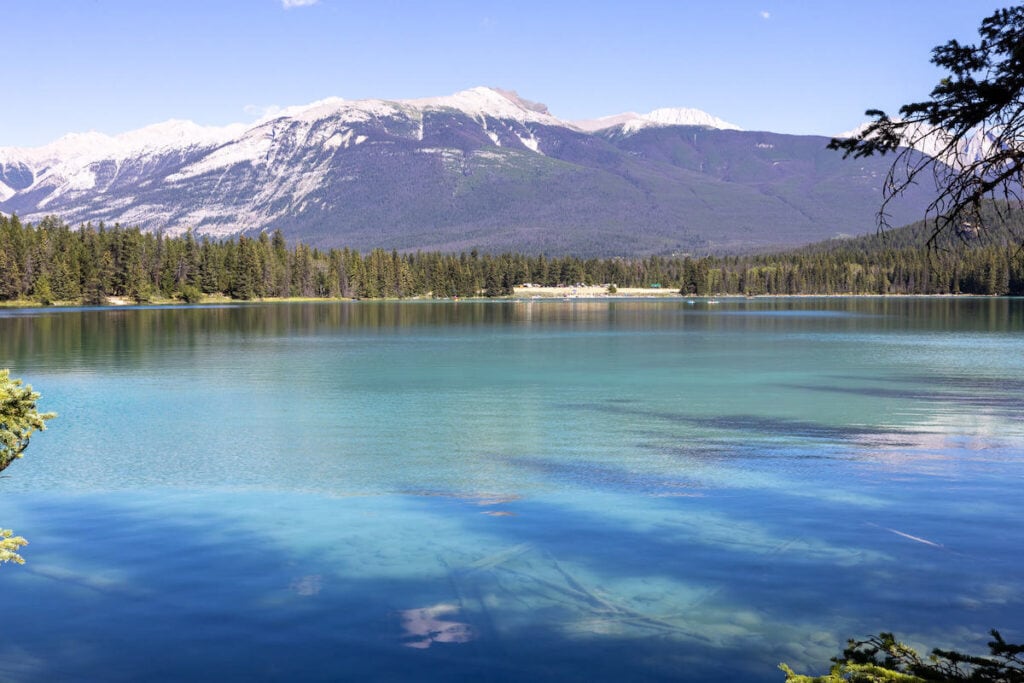 Crystal clear blue waters of Lake Annette near Jasper Alberta