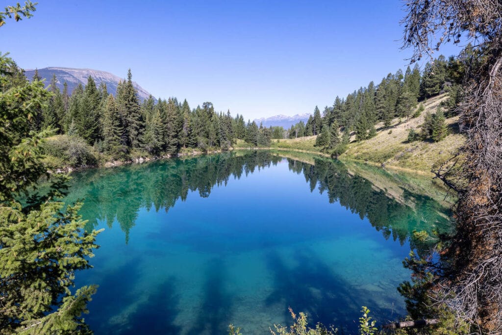 Crystal clear blue lake on Valley of Five Lakes Trail on Icefields Parkway in Alberta