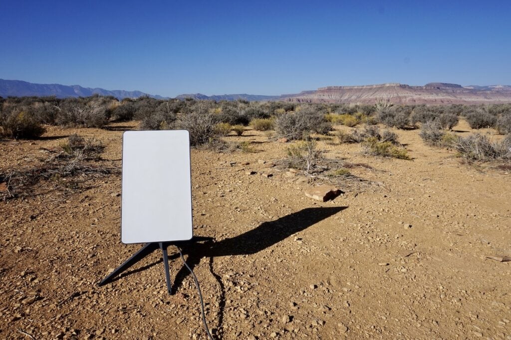 A Starlink satellite internet RV setup for van life. Starlink is set up in the desert outside of Zion National Park