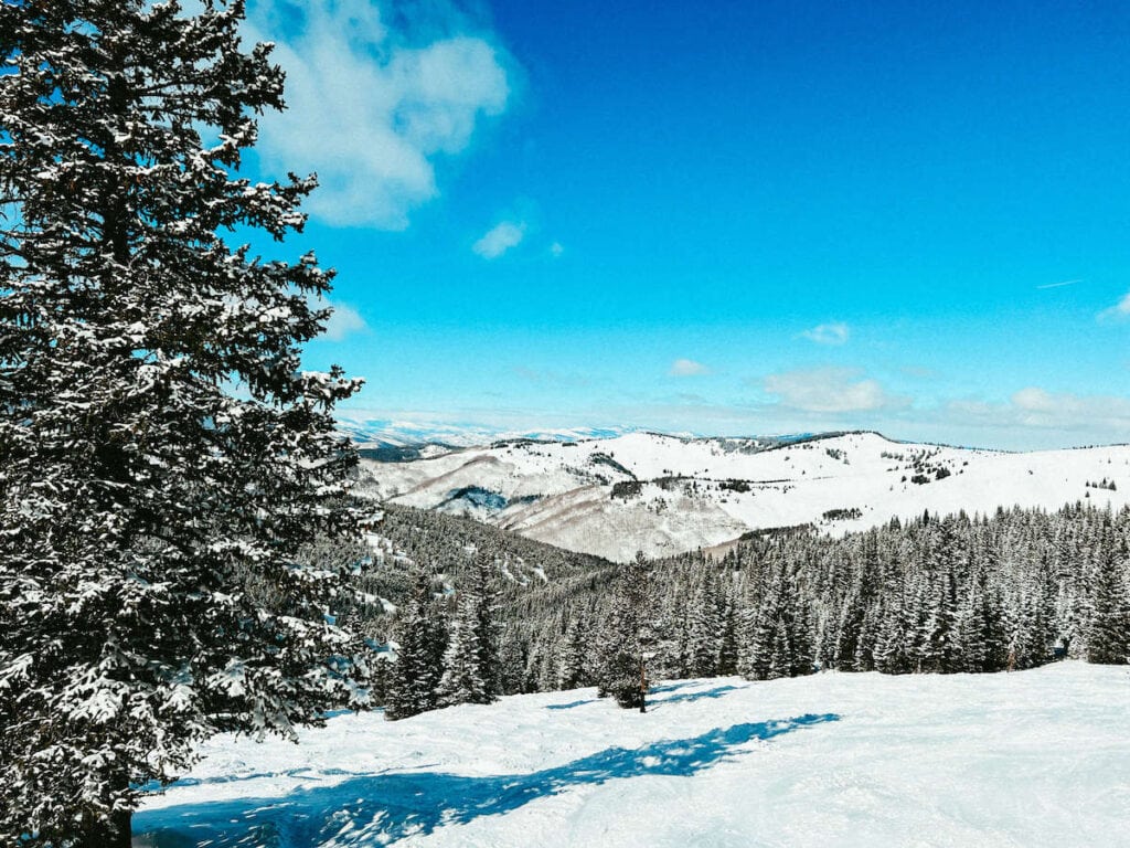 Views out over snowy Rocky Mountain peaks from Aspen Ski Resort in Colorado