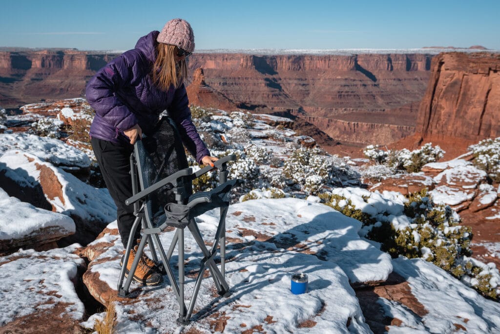 A woman sets up a YETI Trailhead Camp chair in Moab, Utah