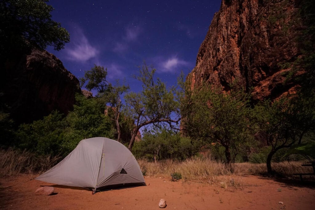 Tent set up at Havasupai Campground at night with twilight skies overhead