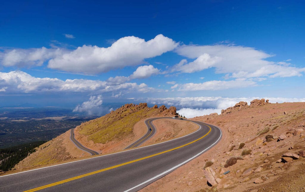 Winding paved road up to summit of Pikes Peak in Colorado