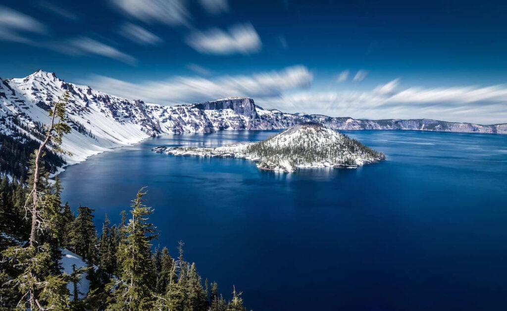 Crater Lake National Park in spring with snow blanketing rim