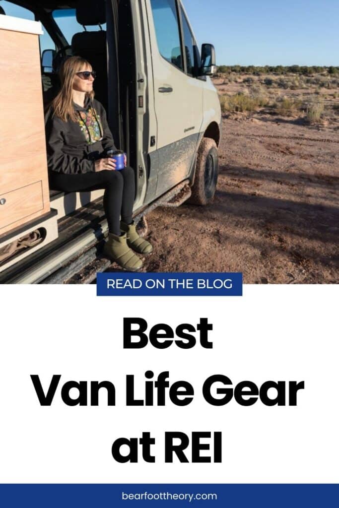 Woman sitting on the edge of Sprinter Van in the desert. Text reads "Best Van life gear at REI"