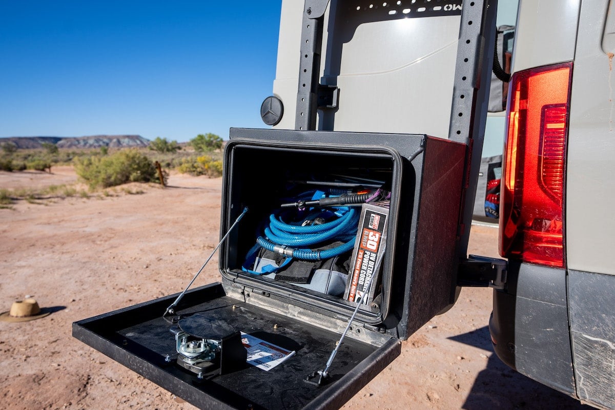 Owl Vans Medium Expedition Box van accessories mounted on the back of a Sprinter van. The box is open and there is gear stored inside.